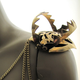 Illustration for article titled Brass bear trap epaulettes add bite to your shoulders